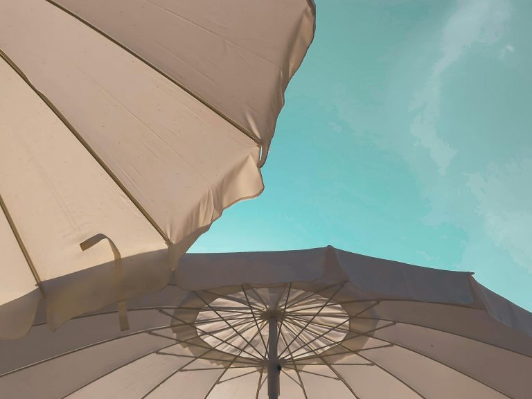 Big umbrellas against blue sky